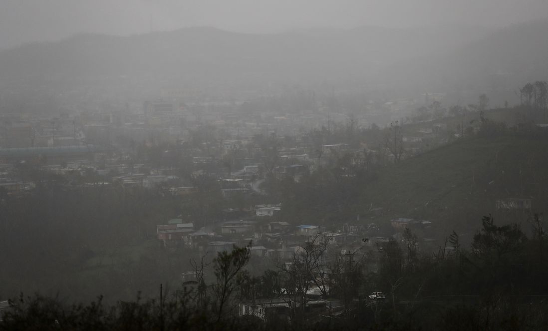 Rain hangs over homes and businesses, three weeks after Hurricane Maria hit the island, on October 11, 2017 in Aibonito, Puerto Rico. <br/>